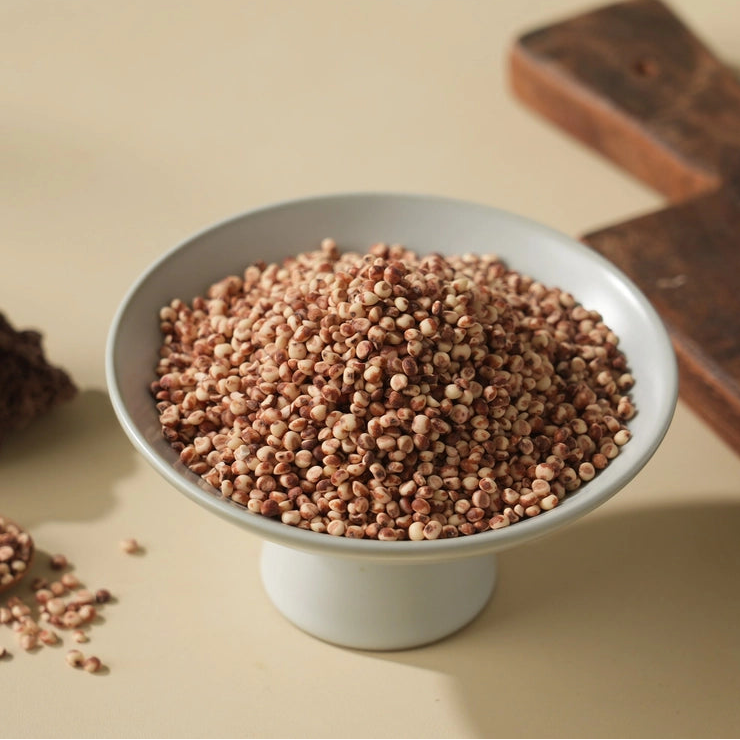 Bowl filled with red millet grains