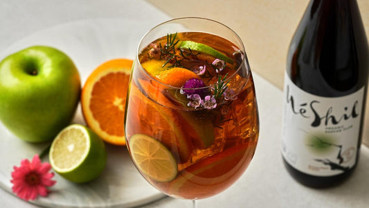 Maesil drink recipe with Korean plum extract, citrus fruits, and herbs in a glass
