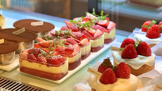 Strawberry desserts displayed in a Korean cafe showcase during peak strawberry season