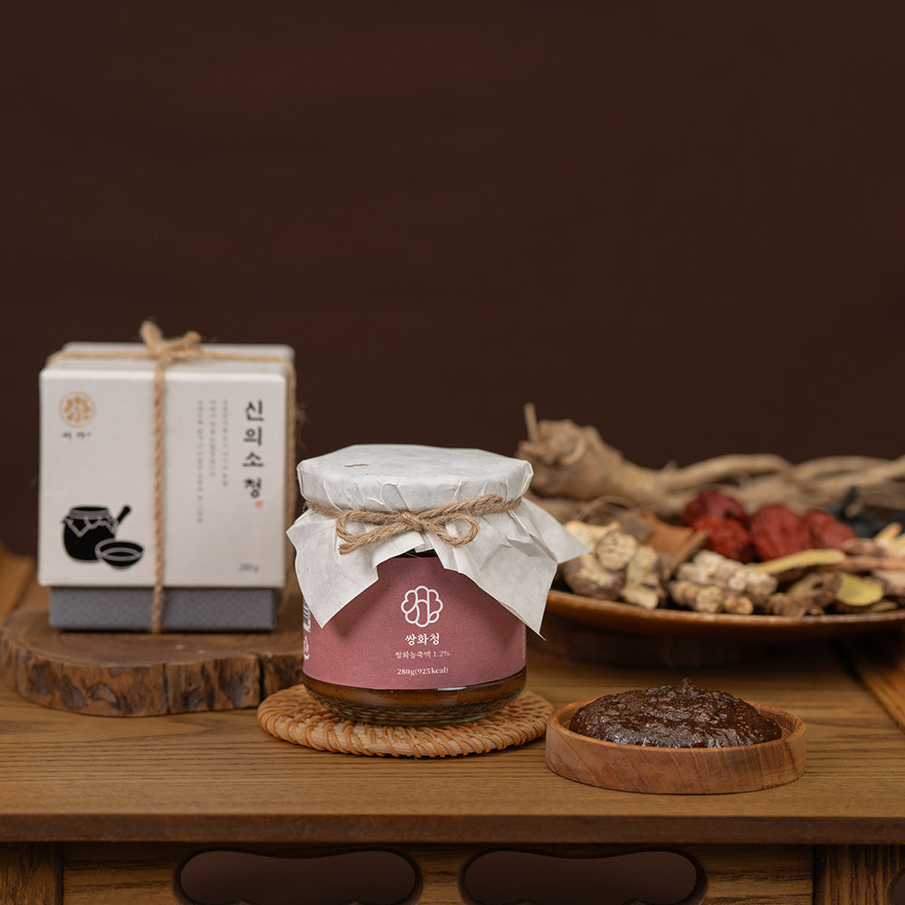 Herbal jar with maroon label and white cloth-tied lid