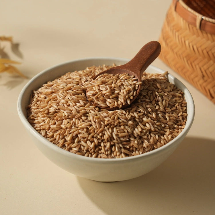 Bowl of organic oats with wooden spoon, dry whole grains