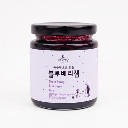 Blueberry fruit jam jar with dark purple contents and black lid