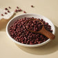 Bowl of pesticide-free Korean red beans with wooden spoon