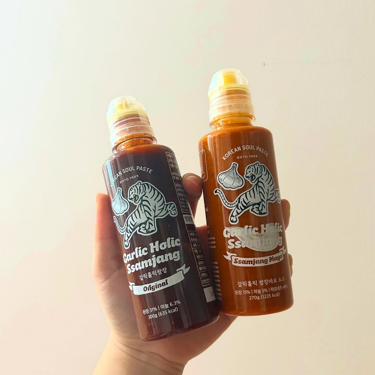 Garlic Holic Ssamjang sauce bottles held together, Original and Ssamjang Mayo