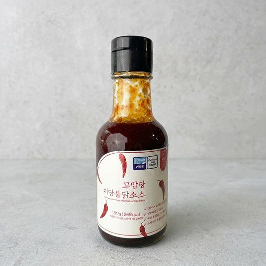 Low-sweet Buldak sauce bottle with label, dark brown sauce