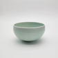 Ceramic rice and soup bowl in pale sage green, rounded shape with glossy glaze
