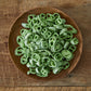 Wooden bowl of sliced green Cheongyang chili peppers