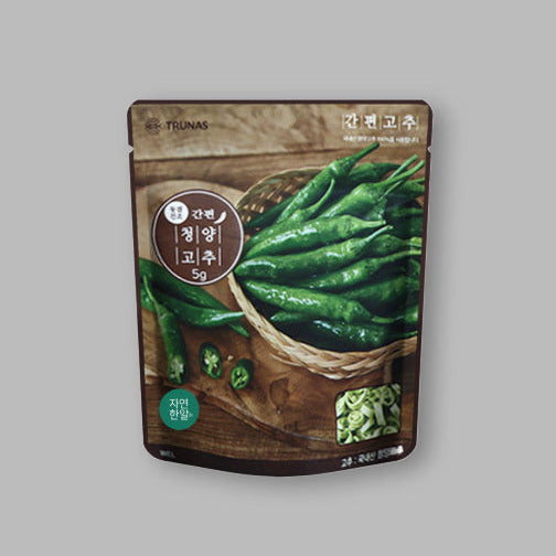 Pack of sliced Cheongyang chili peppers with whole and sliced green chilies on pouch