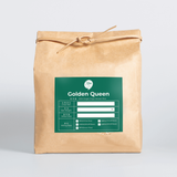 Golden Queen III rice bag in kraft paper with green label and tied ribbon