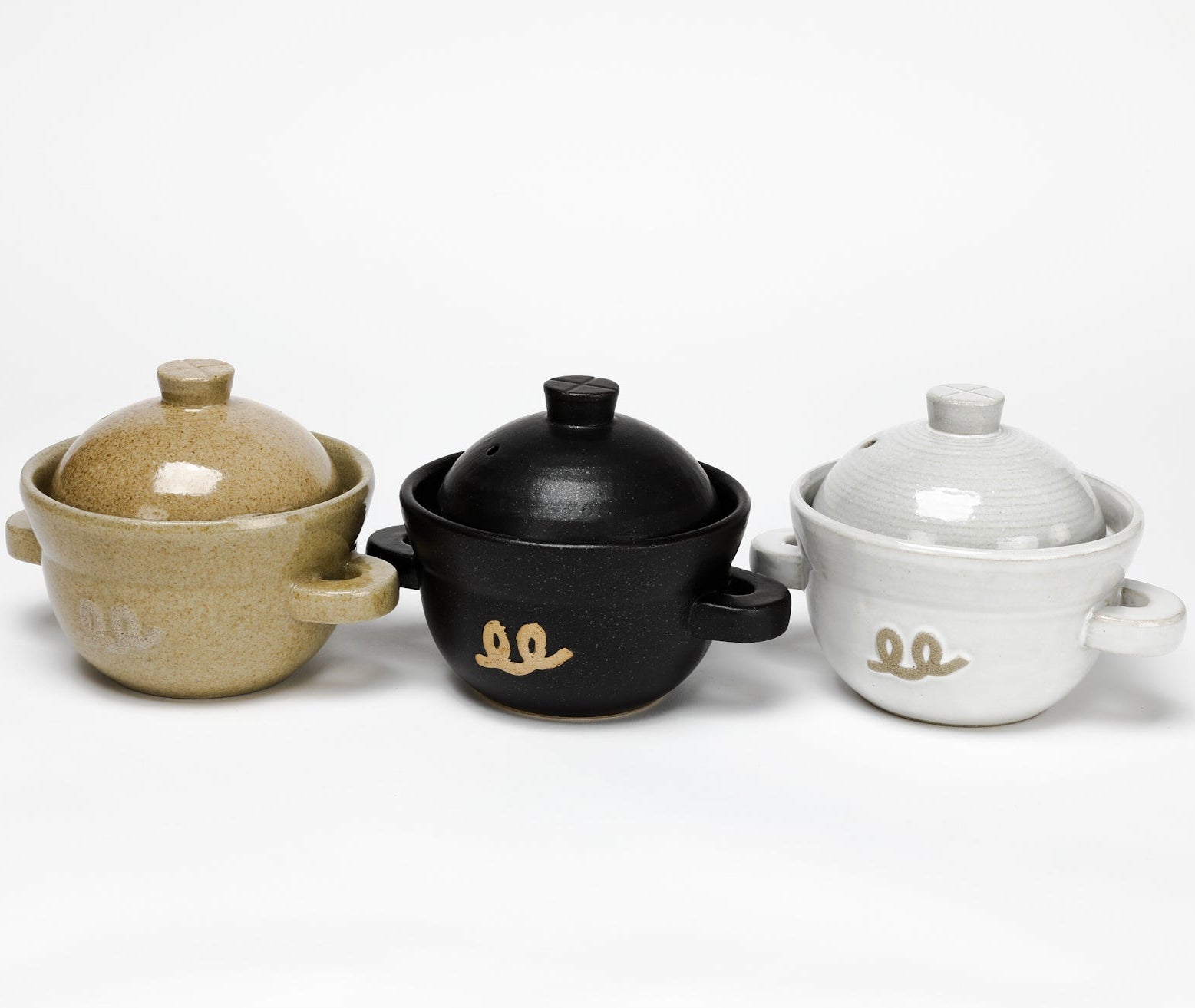 Ceramic rice pot set of three—beige, black, white—each with lid and owl logo