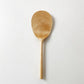 Light wood rice paddle with textured oval scoop and long handle