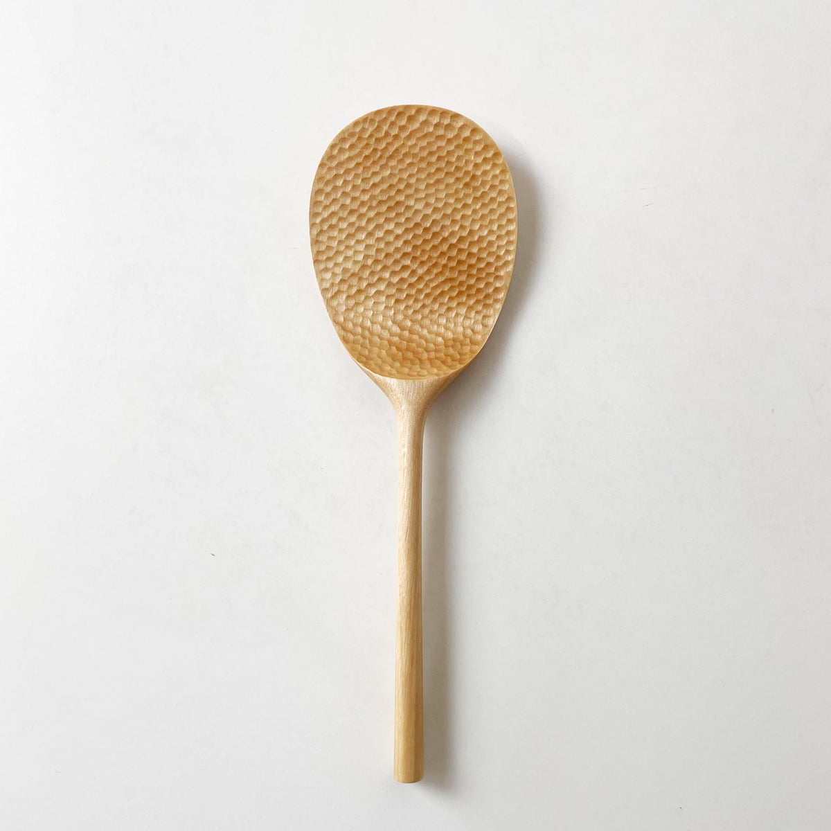 Light wood rice paddle with textured oval scoop and long handle