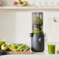 Hurom compact electric juicer, clear container and blue-gray base