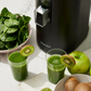 Hurom H400 countertop juicer, black body with integrated spout and front control