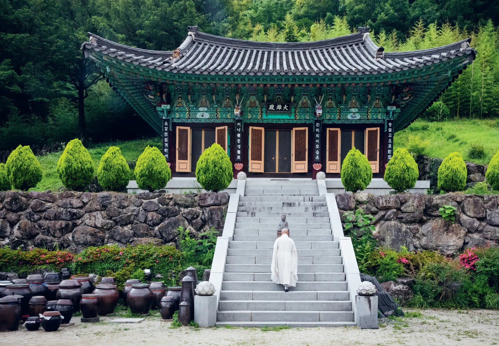 Korean Temple Cooking book open showing a monk walking up temple steps