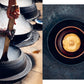 Large metal pot cooking with steam and a bowl of hot broth with a dish