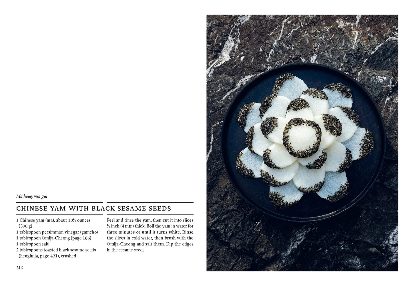 Book page showing a white kimchi dish with black sesame seeds in a dark bowl