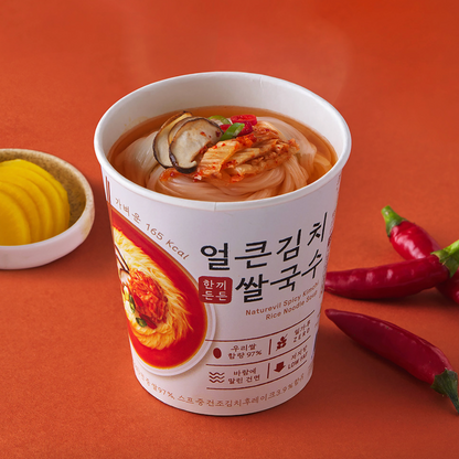 Spicy kimchi rice cup noodles in a white container with chili garnish