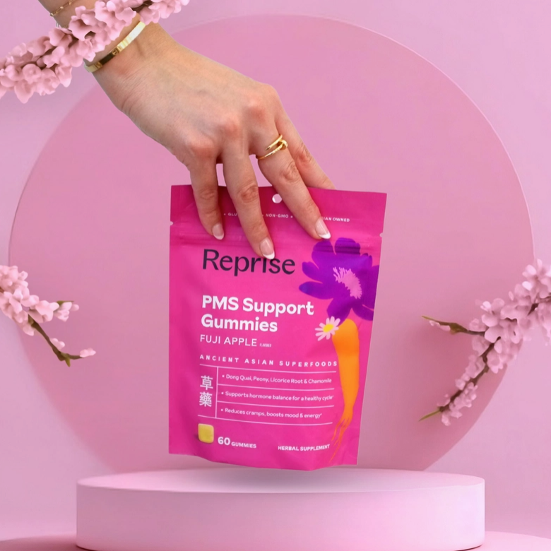 Cycle balance gummies pouch held by hand on pedestal, gold rings visible