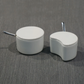 White spice container set with round and moon canisters, each with spoon and lid