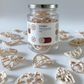 Dried lotus root jar with silver lid and label, with dried slices around