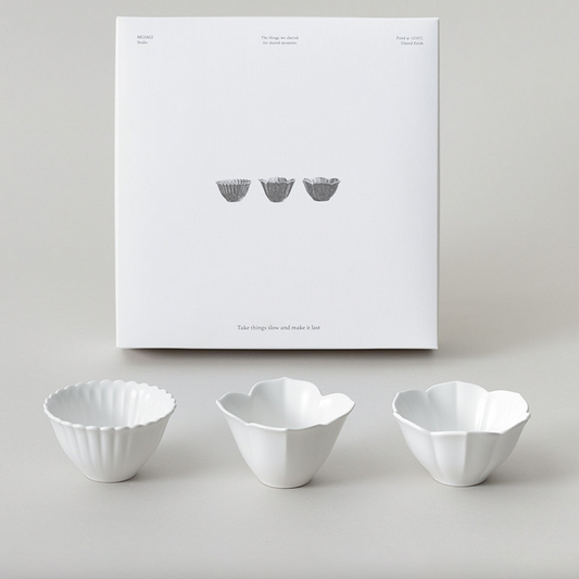 Flower-shaped tiny bowl set with three white bowls, scalloped edges, in a gift box