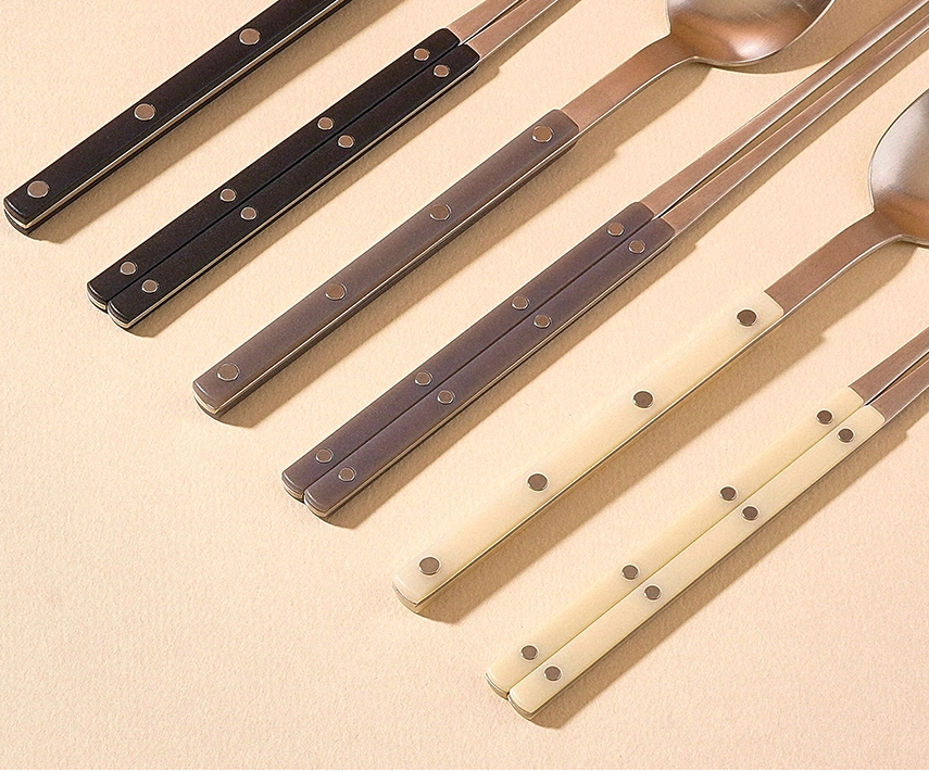 Cutlery set with stainless spoons and chopsticks, dark and vanilla handles with dot accents