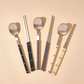 Cutlery set with stainless spoon and chopsticks, mixed light and dark handle colors