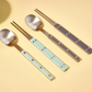 Cutlery set with stainless spoons and chopsticks, light blue and dark purple handles