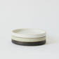 Cream mini ceramic plate with dark base ring and thin warm beige rim