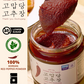 Thank-You gochujang paste in glass jar with thick red chili paste on spoon