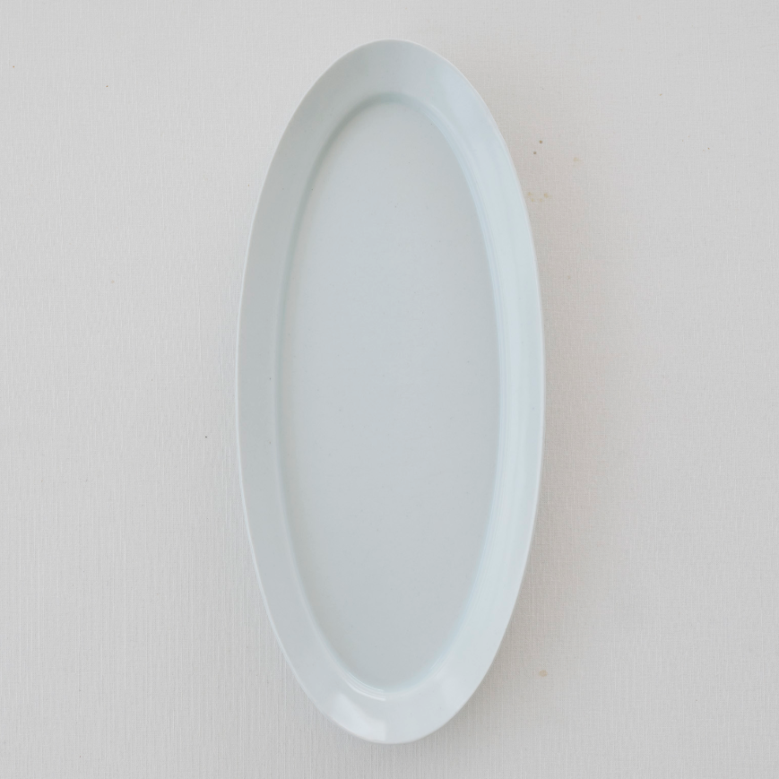 White long oval plate with glossy smooth rim and shallow center