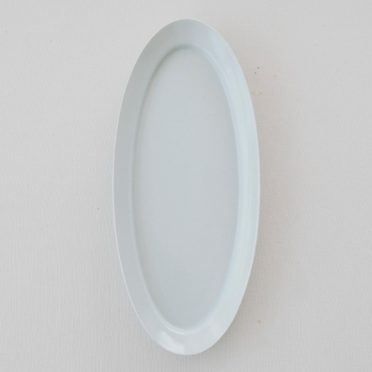 White long oval plate with glossy smooth rim and shallow center