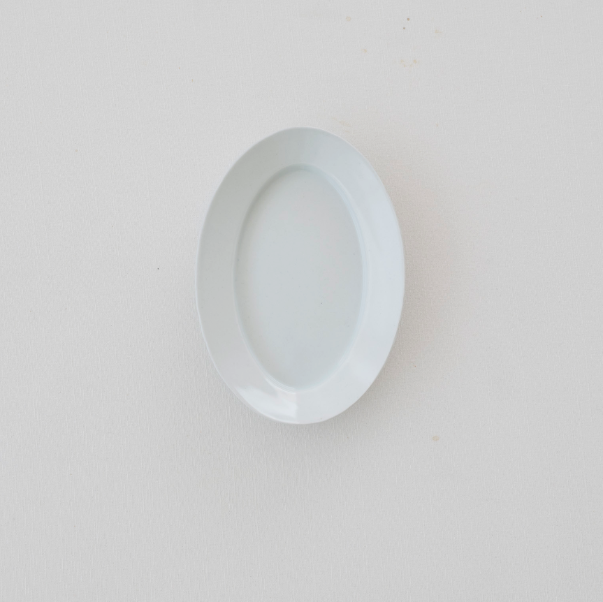 White oval plate, empty, viewed from the front