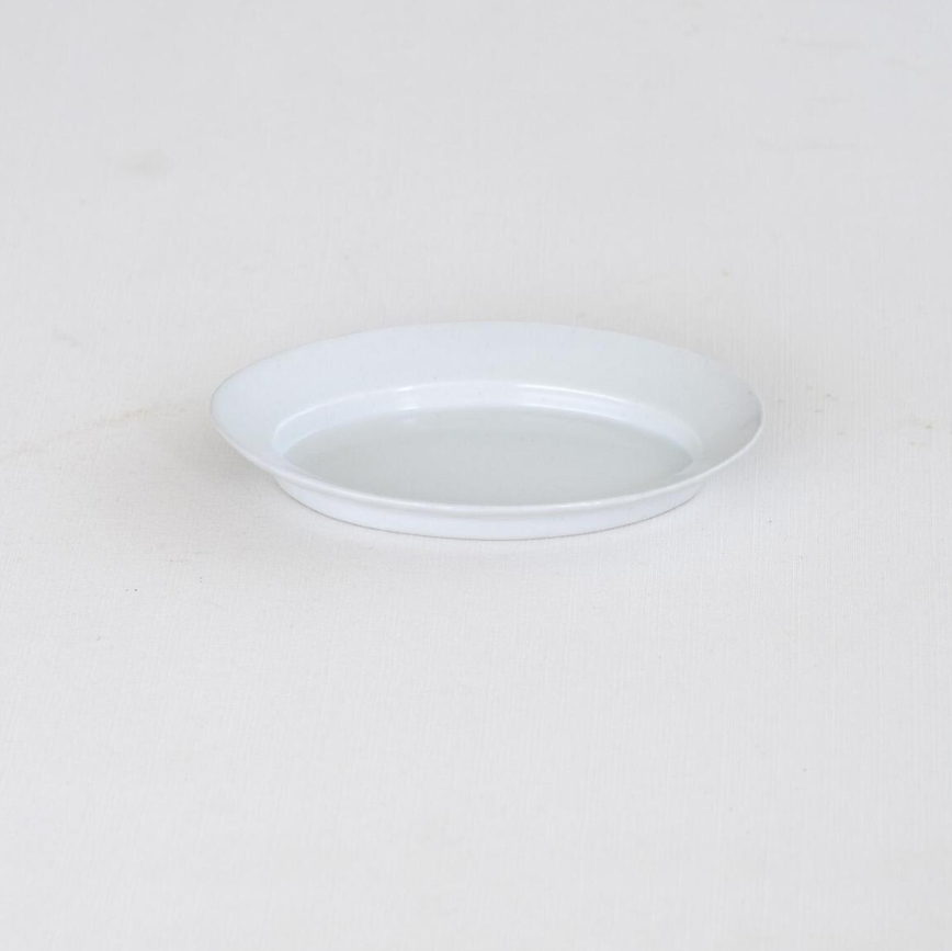White oval plate, empty, side profile