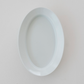 White oval plate, empty, inner oval well visible