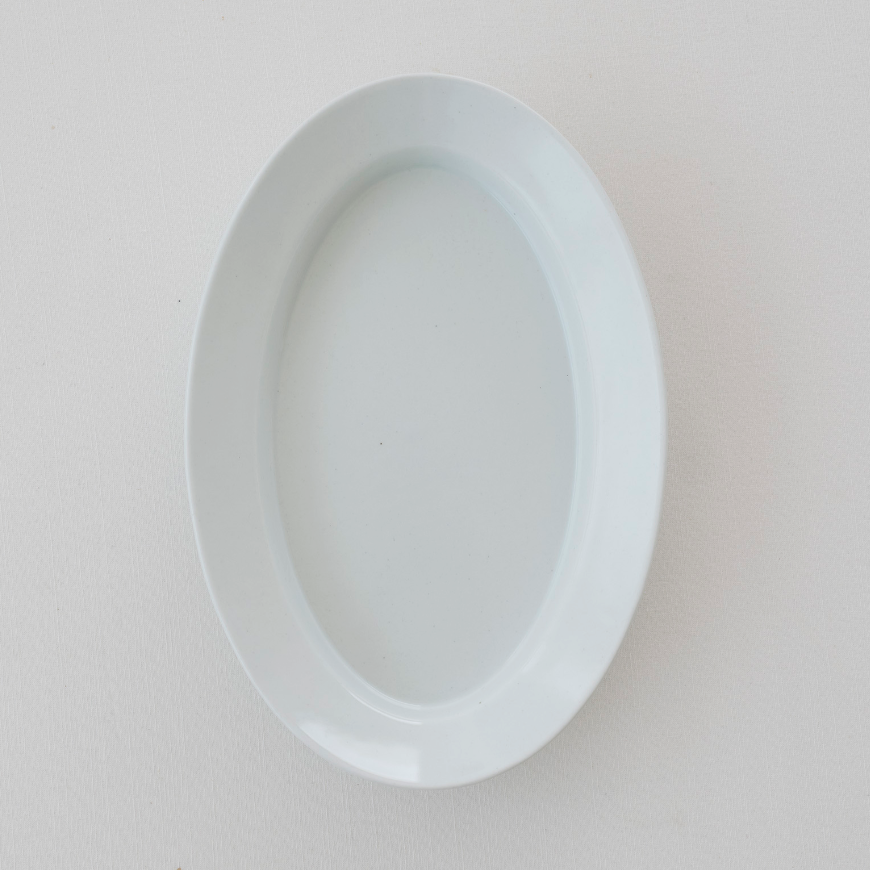 White oval plate, empty, inner oval well visible