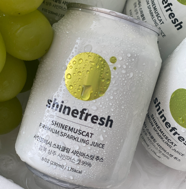 Shine Muscat sparkling juice can close-up with condensation and green muscat label