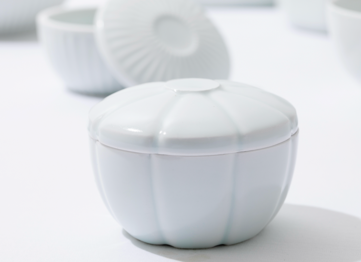 White porcelain lidded container with domed ribbed lid