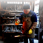 Heukcheopdo work apron: brown leather apron and yellow gloves in workshop