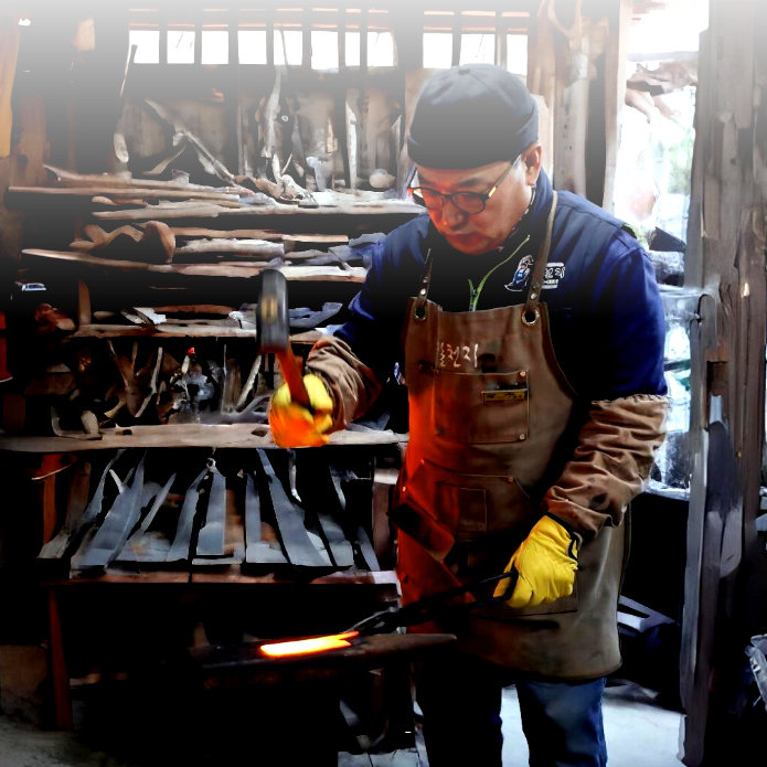 Heukcheopdo work apron: brown leather apron and yellow gloves in workshop