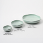 Celadon ceramic bowl set with large and small shallow dishes, embossed fan design