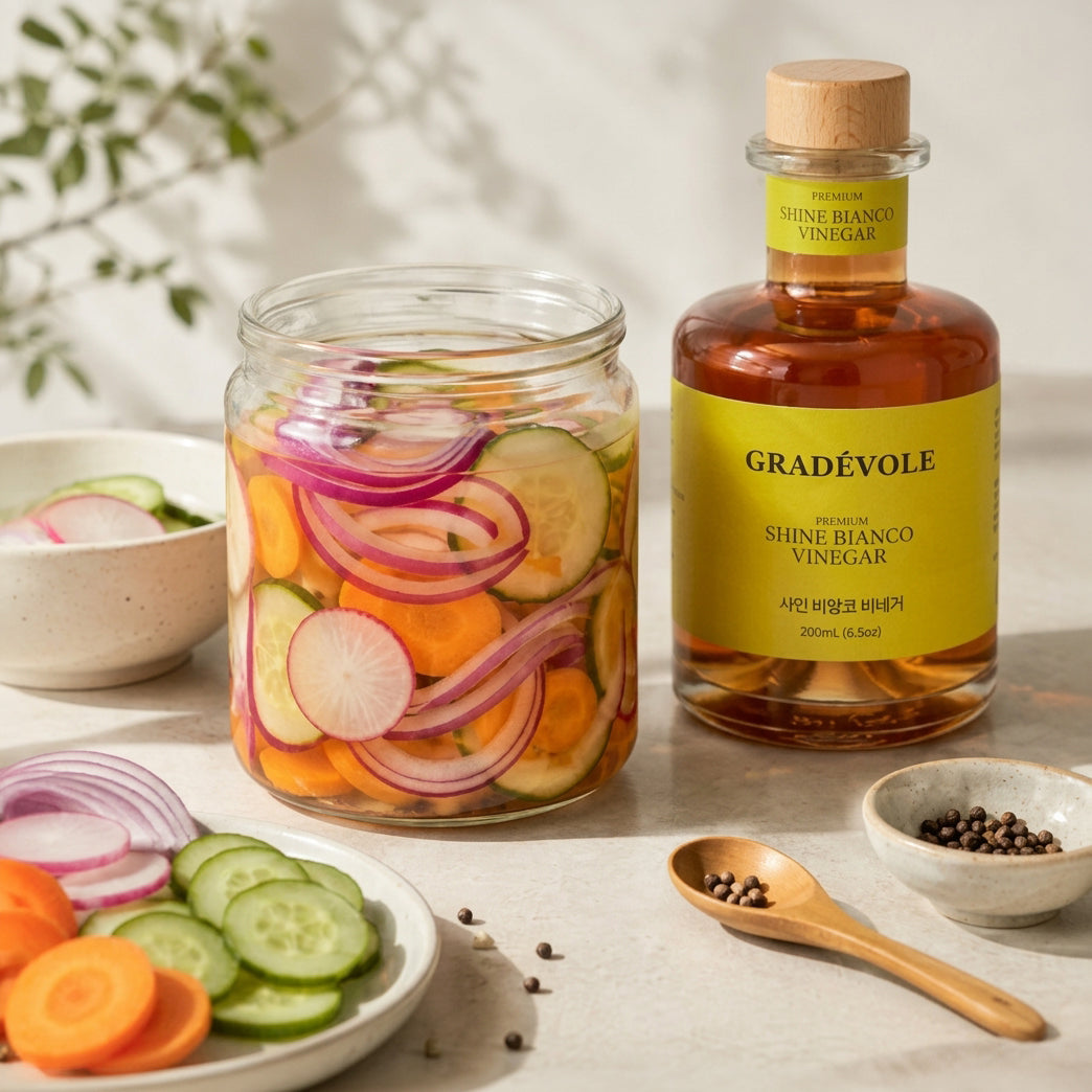 Shine Bianco vinegar bottle with jar of sliced vegetables and onions