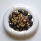 Protein granola bowl with clusters and blueberries