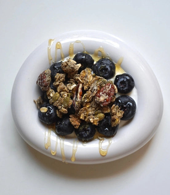 Protein granola bowl with clusters and blueberries