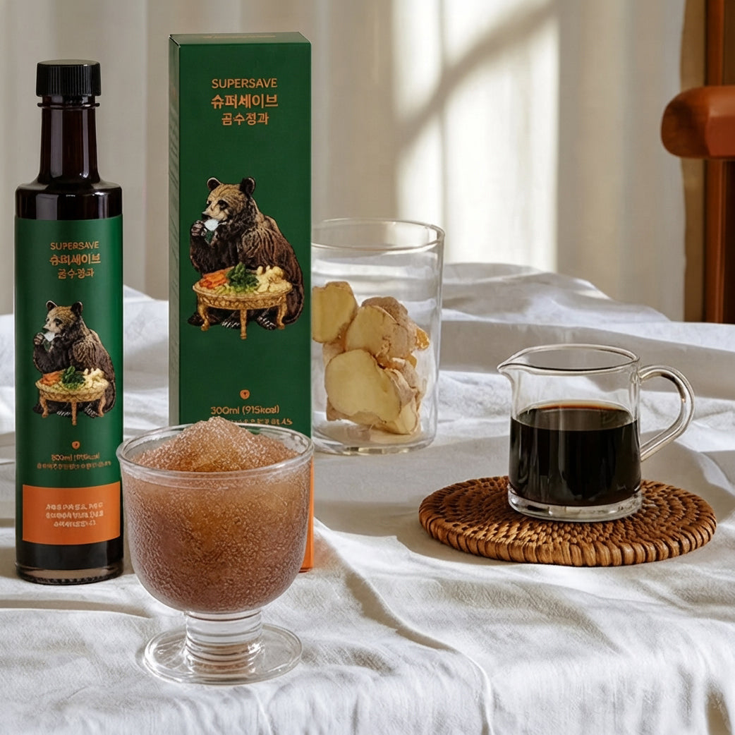 Sujeonggwa concentrate bottle, green carton, and glass of amber drink