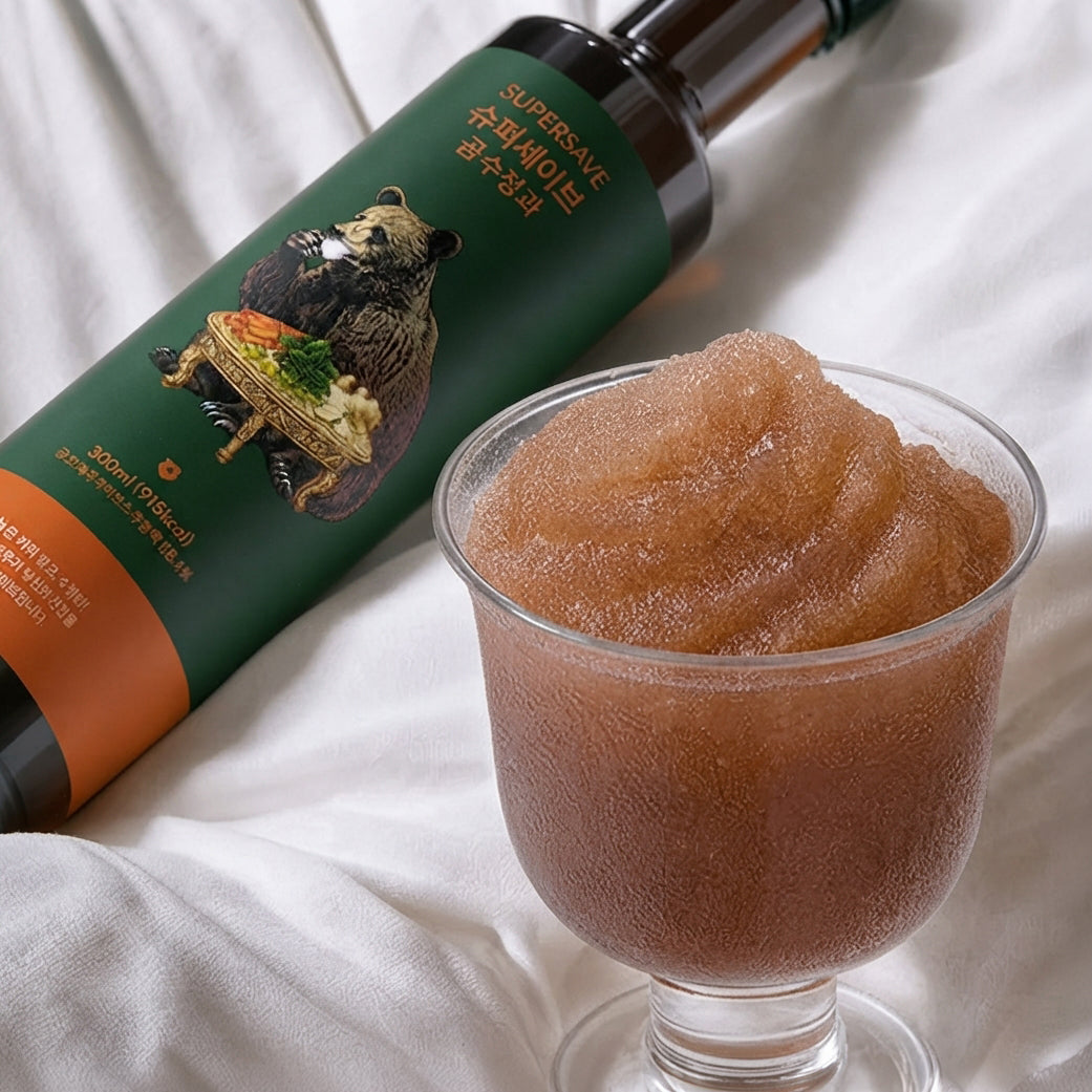 Sujeonggwa concentrate bottle with green carton and glass of amber concentrate
